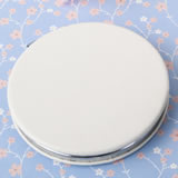 Perfectly plain white leatherette hinged mirror