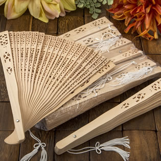 Intricately carved Sandalwood fan favors from fashioncraft