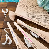 Intricately carved personalized Sandalwood fan favors from fashioncraft