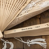 Intricately carved personalized Sandalwood fan favors from fashioncraft