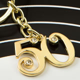 50th design gold metal key chain from fashioncraft